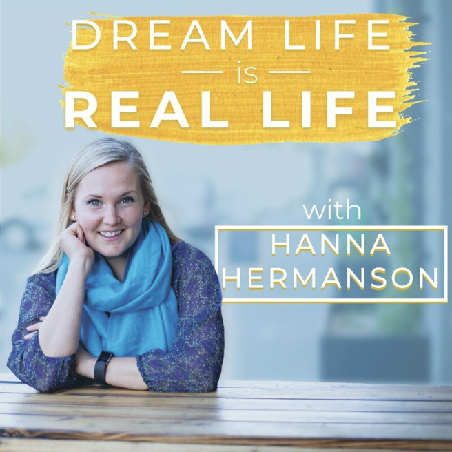 This image is a promotional photo for a podcast. In the background, a woman with blonde hair, smiling, is leaning on her right hand. She's wearing a blue scarf and a purple and green speckled top. In the foreground, there's text overlay in white and gold against a brushstroke of yellow. The text reads "DREAM LIFE IS REAL LIFE with HANNA HERMANSON". The design has a bright and inspiring feel, with the subject conveying a friendly and approachable demeanor.